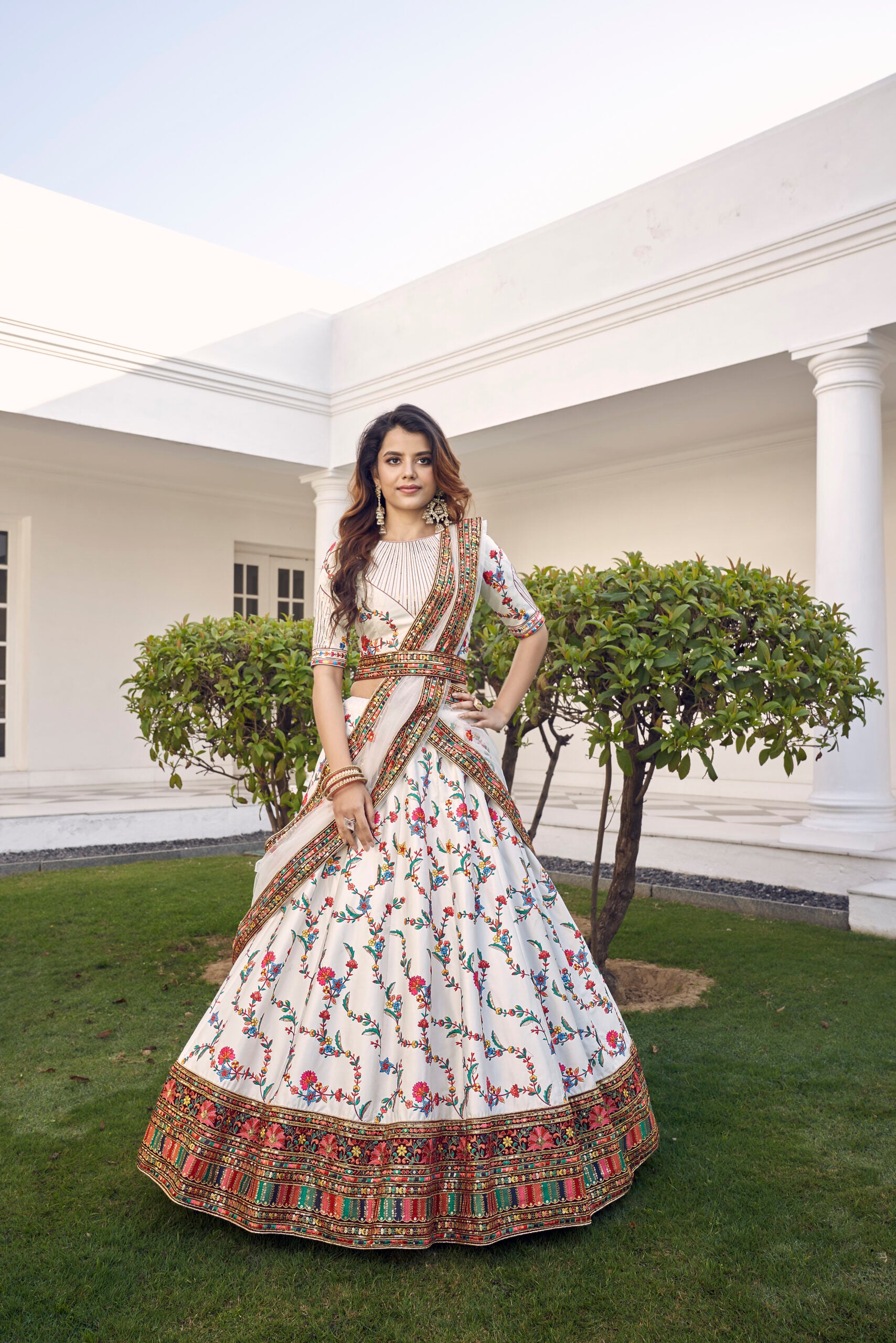Elegant White Silk Lehenga Choli with Delicate Floral Embroidery and Shimmering Sequins