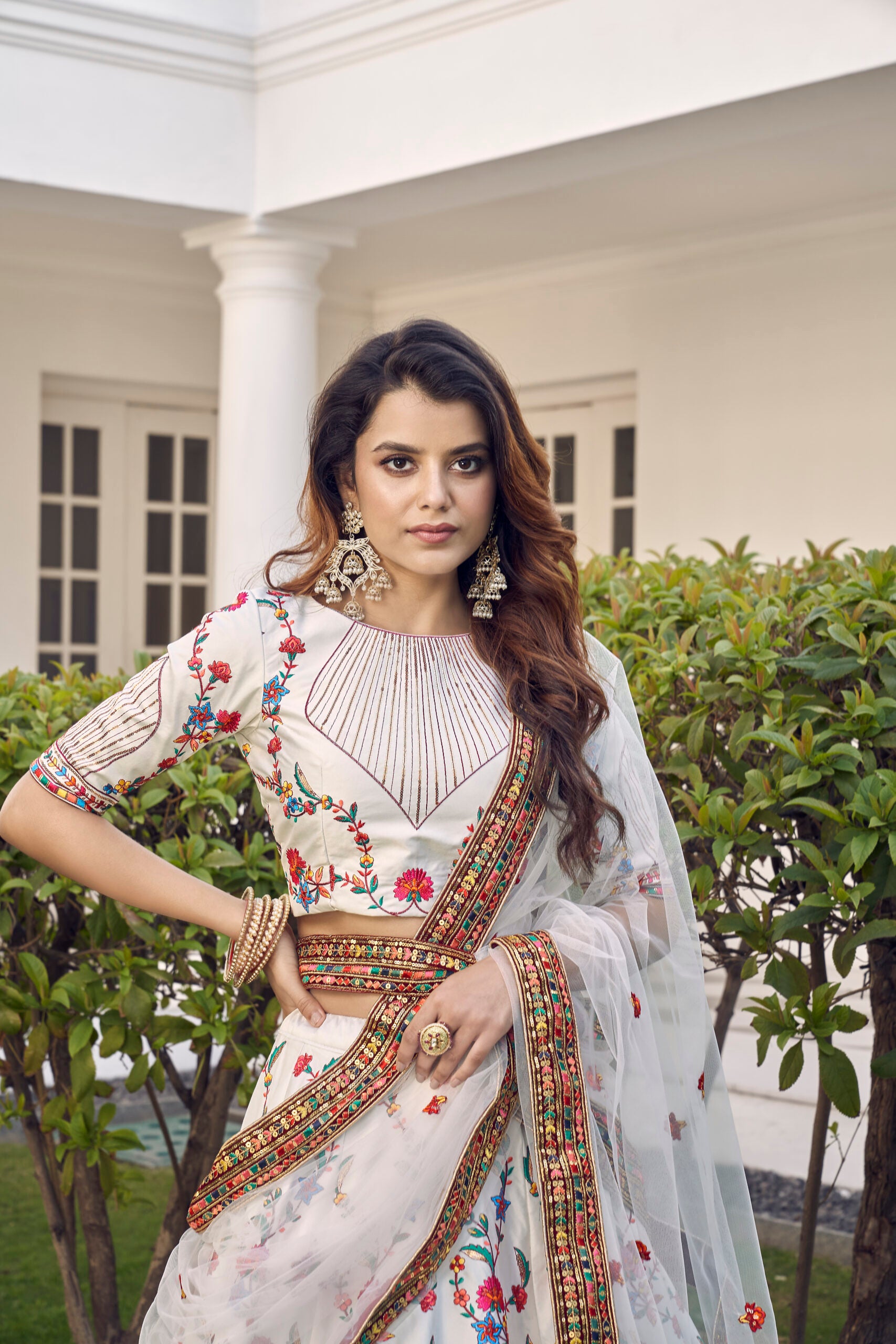 Elegant White Silk Lehenga Choli with Delicate Floral Embroidery and Shimmering Sequins