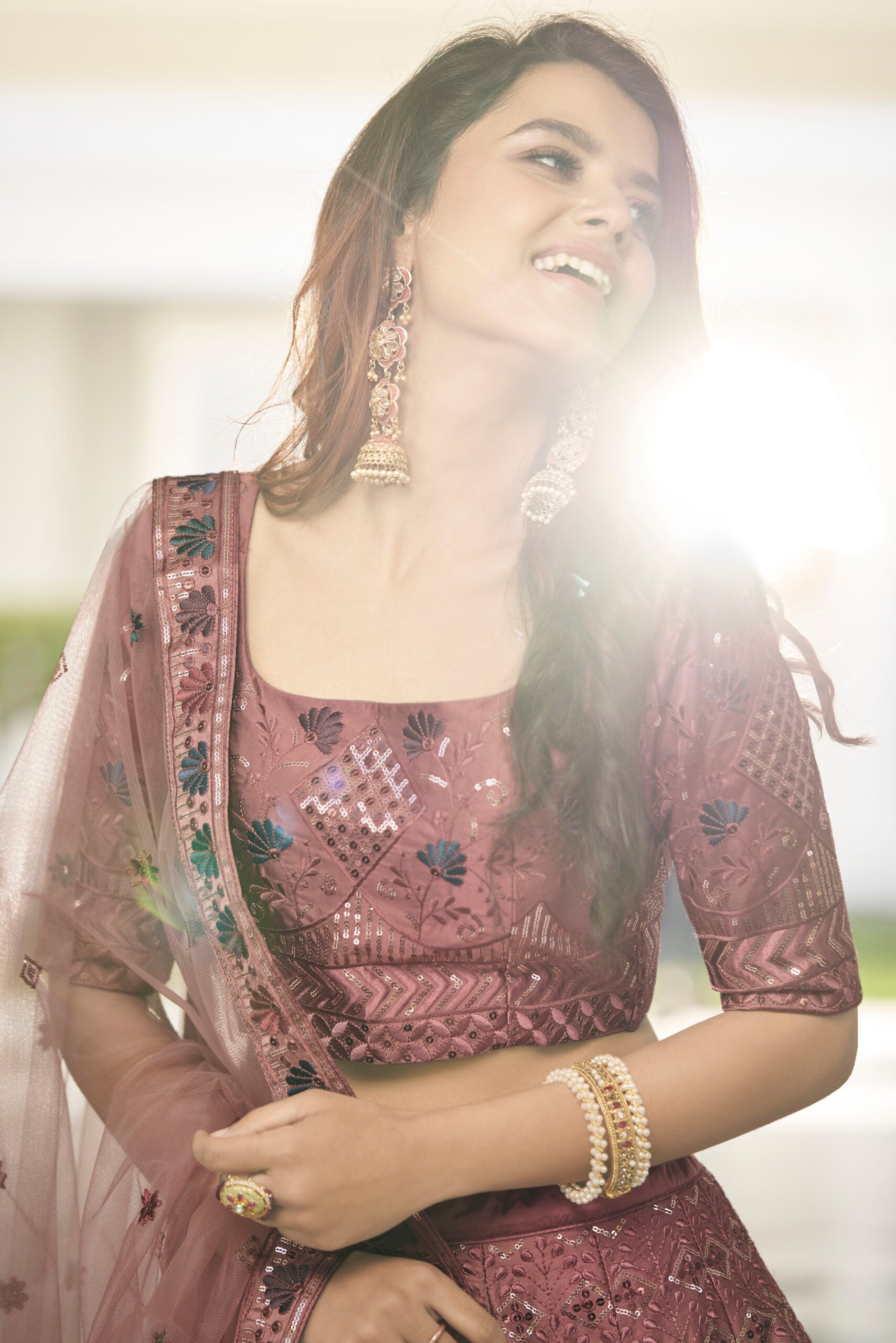 Rust Orange Silk Lehenga Choli with Sparkling Sequin Embellishments and Artistic Threadwork