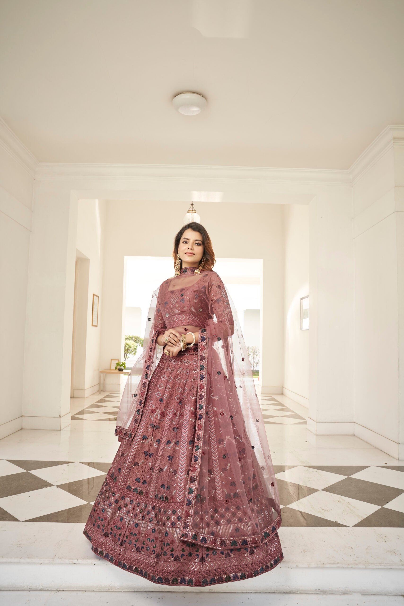Rust Orange Silk Lehenga Choli with Sparkling Sequin Embellishments and Artistic Threadwork