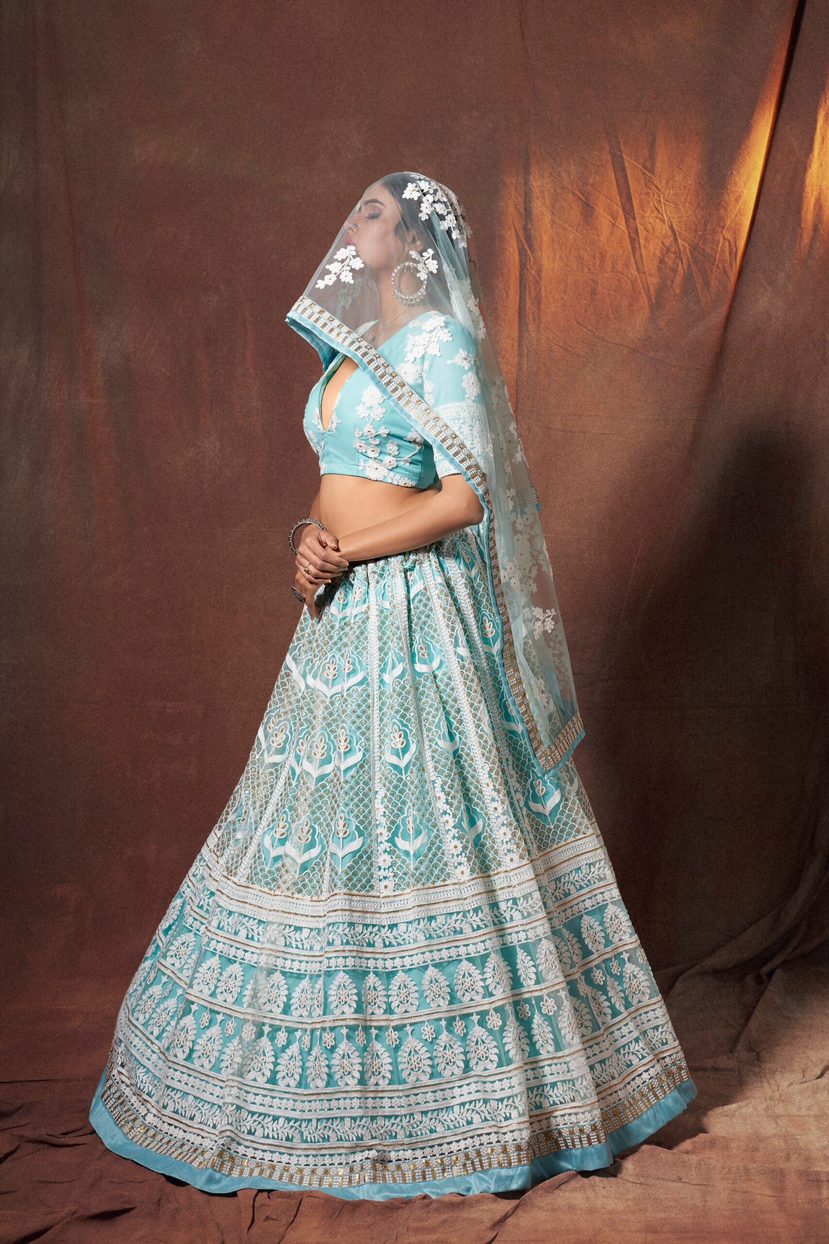 Turquoise Temptation Resham Net Lehenga